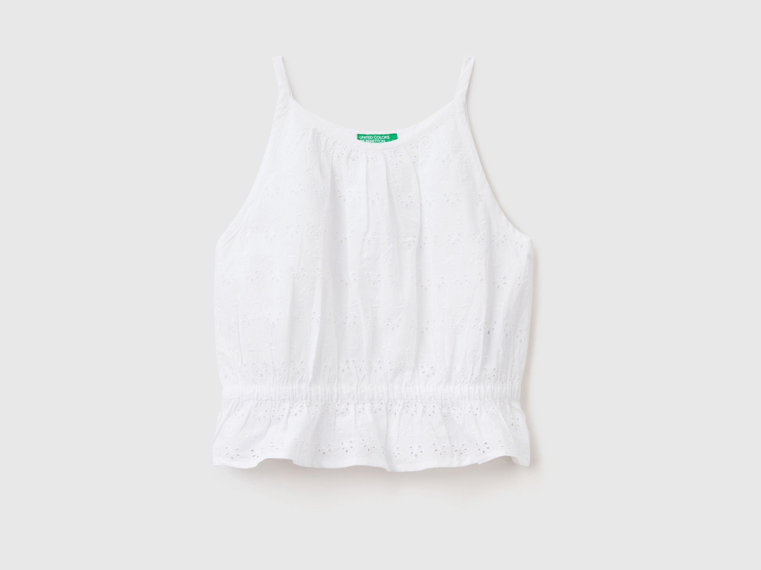 Top with broderie anglaise embroidery